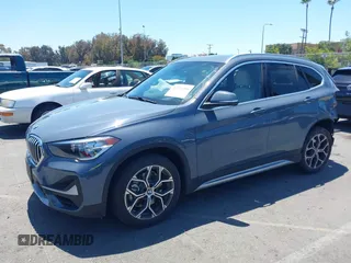 2021 BMW X1 sDrive28i z VIN WBXJG7C02M5T37169, wystawiony jako IAAI lot #42226396 z przebiegiem 48 603 mil mil oraz . Historia ofert i sprzedaży dostępna na DreamBid. Obrazek 20.