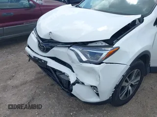 2017 Toyota RAV4 XLE with VIN JTMWFREV8HJ118885, listed as a IAAI auction lot 42097180 with 122,481 mi miles. Bid and sale history available at carsss.com. Image 6.