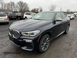 2021 BMW X6 M50i with VIN 5UXCY8C02M9D95172, listed as a Copart auction lot 84796854 with 75,299 mi miles and Clean Title. Bid and sale history available at carsss.com. Image 1.