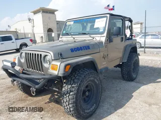 2005 Jeep Wrangler SE with VIN 1J4FA29S25P328827, listed as a IAAI auction lot 41917807 with 157,562 mi miles. Bid and sale history available at carsss.com. Image 2.
