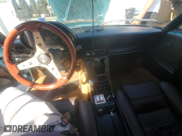 1989 Alfa Romeo Spider z VIN ZARBA5587K1066209, wystawiony jako Copart lot #77166704 z przebiegiem 98 255 mil mil oraz Szkoda całkowita • Salvage title. Historia ofert i sprzedaży dostępna na DreamBid. Obrazek 9.