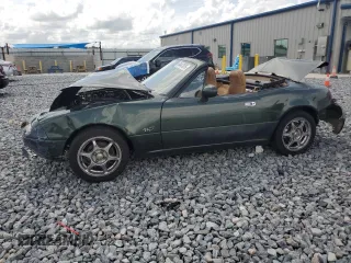 1997 Mazda MX-5 Miata with VIN JM1NA353XV0727354, listed as a Copart auction lot 64447075 with 217,959 mi miles and Salvage title. Bid and sale history available at DreamBid. Image 1.