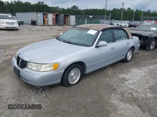 1998 Lincoln Town Car Signature with VIN 1LNFM82WXWY659028, listed as a IAAI auction lot 42265774 with 164,400 mi miles and . Bid and sale history available at DreamBid. Image 2.