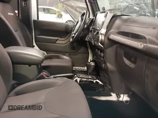 2017 Jeep Wrangler Unlimited Sport with VIN 1C4BJWDG9HL565213, listed as a IAAI auction lot 40999452 with 50,586 mi miles. Bid and sale history available at carsss.com. Image 5.