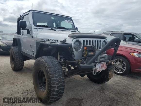 2003 Jeep Wrangler Rubicon z VIN 1J4FA69S53P340085, wystawiony jako Copart lot #74564574 z przebiegiem Nie podano mil oraz Szkoda całkowita • Salvage title. Historia ofert i sprzedaży dostępna na DreamBid. Obrazek 4.