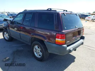 1996 Jeep Grand Cherokee Laredo with VIN 1J4GZ58S3TC391942, listed as a IAAI auction lot 41711778 with 202,765 mi miles. Bid and sale history available at carsss.com. Image 3.