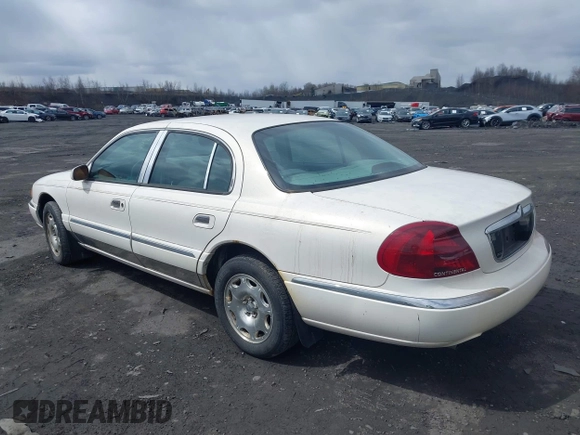 1998 Lincoln Continental with VIN 1LNFM97V2WY738814, listed as a IAAI auction lot 41992844 with 147,066 mi miles. Bid and sale history available at carsss.com. Image 3.