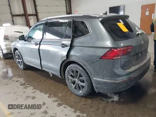 2023 Volkswagen Tiguan SE with VIN 3VVMB7AX5PM013447, listed as a IAAI auction lot 41615200 with 66,259 mi miles and . Bid and sale history available at DreamBid. Image 3.