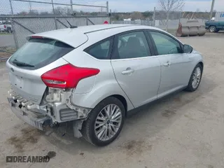 2015 Ford Focus Titanium with VIN 1FADP3N27FL228549, listed as a IAAI auction lot 41912941 with 69,025 mi miles. Bid and sale history available at carsss.com. Image 4.