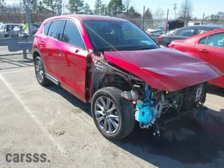2020 Mazda CX-5 Grand Touring with VIN JM3KFADMXL0780871, listed as a IAAI auction lot 41418137 with 86,756 mi miles. Bid and sale history available at carsss.com. Image 1.