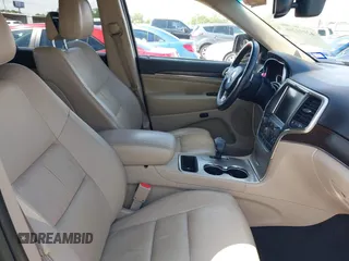 2014 Jeep Grand Cherokee Limited with VIN 1C4RJEBG9EC201512, listed as a IAAI auction lot 42091266 with 129,897 mi miles and . Bid and sale history available at DreamBid. Image 5.