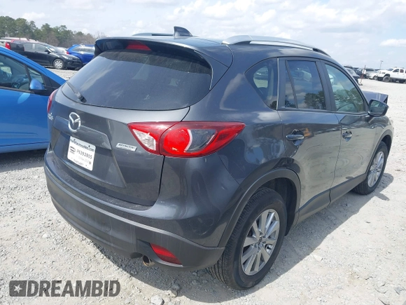 2015 Mazda CX-5 Touring with VIN JM3KE2CY2F0530204, listed as a IAAI auction lot 41788921 with 50,827 mi miles. Bid and sale history available at carsss.com. Image 4.