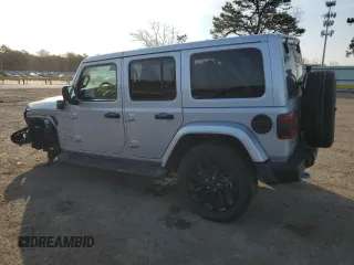 2024 Jeep Wrangler Sahara with VIN 1C4RJXP60RW128448, listed as a Copart auction lot 48658135 with 5,879 mi miles and Salvage Title. Bid and sale history available at DreamBid. Image 2.