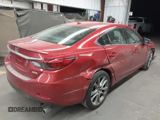2016 Mazda 6 i Grand Touring с VIN JM1GJ1W50G1474054, выставлен на аукционе IAAI как лот 42162163 с пробегом 97 169 миль миль и . История ставок и продаж доступна на DreamBid. Изображение 4.