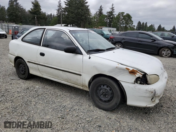 1999 Hyundai Accent with VIN KMHVD14N9XU503210, listed as a Copart auction lot 56486325 with 195,501 mi miles and Salvage title. Bid and sale history available at DreamBid. Image 4.