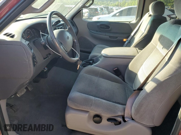 2002 Ford F-150 XL with VIN 1FTRX18L82NA54692, listed as a Copart auction lot 62559605 with 216,350 mi miles and Salvage title. Bid and sale history available at DreamBid. Image 7.