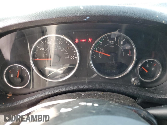 2012 Jeep Wrangler Sport z VIN 1C4AJWAG9CL257841, wystawiony jako Copart lot #57731255 z przebiegiem 112 614 mil mil oraz Szkoda całkowita • Salvage title. Historia ofert i sprzedaży dostępna na DreamBid. Obrazek 9.