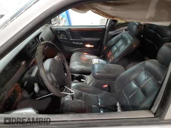 1997 Jeep Grand Cherokee Limited with VIN 1J4GZ78Y4VC589688, listed as a Copart auction lot 84673974 with 183,930 mi miles and Salvage Title. Bid and sale history available at carsss.com. Image 7.