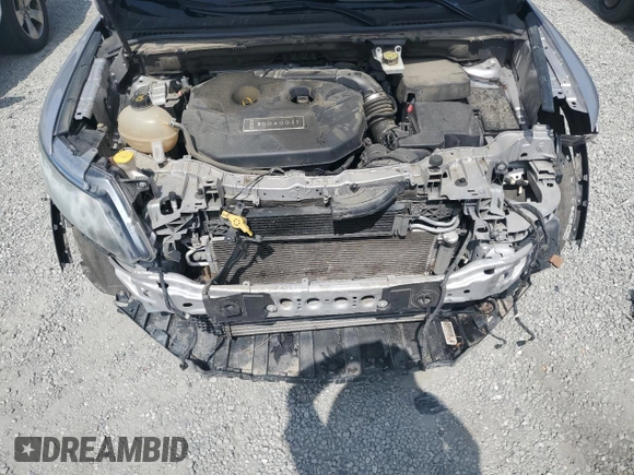 2017 Lincoln MKC Premiere z VIN 5LMCJ1C95HUL11303, wystawiony jako Copart lot #58263945 z przebiegiem 82 628 mil mil oraz Szkoda całkowita • Salvage title. Historia ofert i sprzedaży dostępna na DreamBid. Obrazek 12.