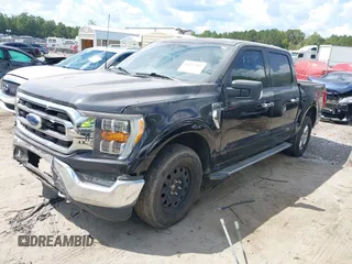 2021 Ford F-150 XL with VIN 1FTFW1E5XMKE21429, listed as a IAAI auction lot 40347406 with 125,000 mi miles. Bid and sale history available at carsss.com. Image 2.