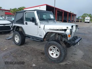 2005 Jeep Wrangler Rubicon z VIN 1J4FA69S05P339624, wystawiony jako IAAI lot #42760598 z przebiegiem 105 600 mil mil oraz . Historia ofert i sprzedaży dostępna na DreamBid. Obrazek 1.