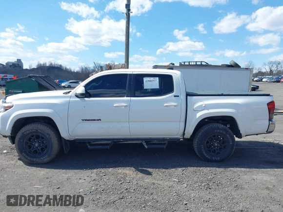 2020 Toyota Tacoma SR5 with VIN 3TMCZ5AN5LM339977, listed as a IAAI auction lot 41886937 with 94,986 mi miles and . Bid and sale history available at DreamBid. Image 14.