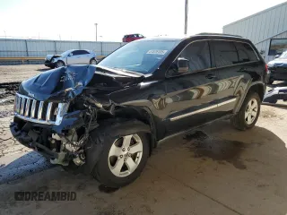 2012 Jeep Grand Cherokee Laredo with VIN 1C4RJEAG2CC215525, listed as a Copart auction lot 51876105 with 148,659 mi miles and Salvage Title. Bid and sale history available at carsss.com. Image 1.