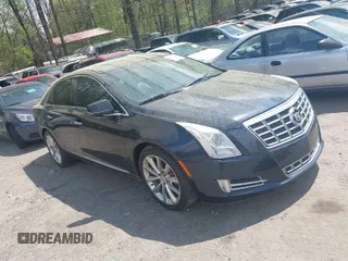 2013 Cadillac XTS Luxury with VIN 2G61P5S36D9214588, listed as a IAAI auction lot 41953947 with 142,204 mi miles. Bid and sale history available at carsss.com. Image 1.