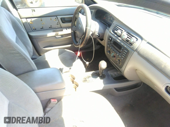 2005 Ford Taurus SE with VIN 1FAFP53U85A129306, listed as a IAAI auction lot 40585457 with 329,569 mi miles. Bid and sale history available at carsss.com. Image 5.
