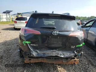 2018 Toyota RAV4 XLE with VIN 2T3RFREV0JW765995, listed as a Copart auction lot 63968785 with 114,598 mi miles and Salvage title. Bid and sale history available at DreamBid. Image 6.