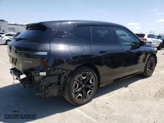 2024 BMW iX xDrive50 with VIN WB523CF05RCN96948, listed as a Copart auction lot 50858304 with 8,923 mi miles and Salvage Title. Bid and sale history available at carsss.com. Image 3.