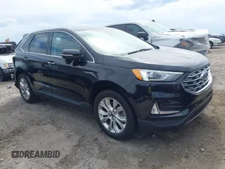 2021 Ford Edge Titanium z VIN 2FMPK3K99MBA16882, wystawiony jako IAAI lot #42214606 z przebiegiem 140 031 mil mil oraz . Historia ofert i sprzedaży dostępna na DreamBid. Obrazek 1.