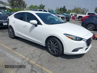 2018 Mazda 3 Touring z VIN 3MZBN1V35JM182020, wystawiony jako IAAI lot #42175061 z przebiegiem 86 153 mil mil oraz . Historia ofert i sprzedaży dostępna na DreamBid. Obrazek 1.