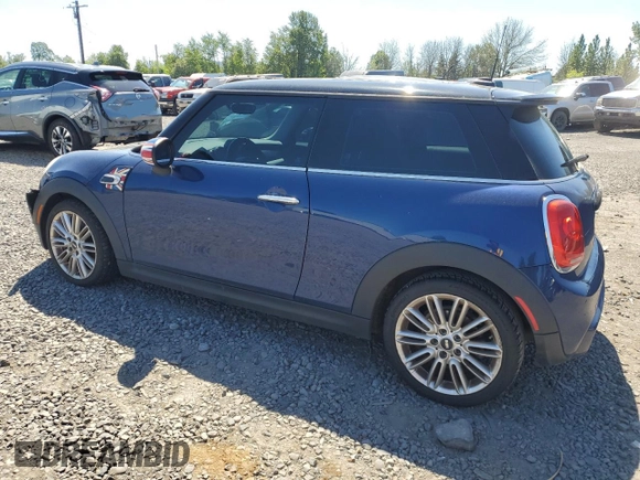 2014 MINI Hardtop S with VIN WMWXM7C51ET926090, listed as a Copart auction lot 55958745 with 148,997 mi miles and Salvage title. Bid and sale history available at DreamBid. Image 2.