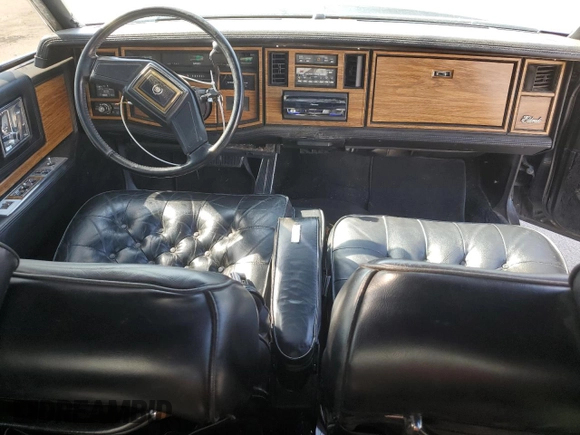 1985 Cadillac Eldorado z VIN 1G6EL5780FE622179, wystawiony jako Copart lot #54109205 z przebiegiem 73 403 mil mil oraz Szkoda całkowita • Salvage title. Historia ofert i sprzedaży dostępna na DreamBid. Obrazek 8.