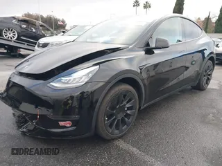 2023 Tesla Model Y Long Range with VIN 7SAYGDEE2PA024032, listed as a IAAI auction lot 41213403 with 23,418 mi miles and . Bid and sale history available at DreamBid. Image 2.