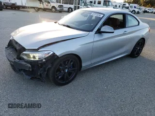 2016 BMW 2 Series M235i with VIN WBA1J7C58GV360015, listed as a Copart auction lot 87273234 with 69,827 mi miles and Salvage Title. Bid and sale history available at carsss.com. Image 1.