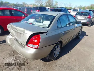 2003 Hyundai Elantra GLS z VIN KMHDN45D93U495703, wystawiony jako IAAI lot #42137927 z przebiegiem 93 287 mil mil oraz . Historia ofert i sprzedaży dostępna na DreamBid. Obrazek 4.