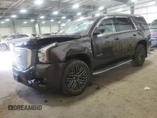 2015 GMC Yukon SLT with VIN 1GKS2BKC7FR279302, listed as a Copart auction lot 47827085 with 176,076 mi miles and Salvage Title. Bid and sale history available at carsss.com. Image 1.