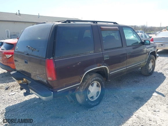 1997 Chevrolet Tahoe with VIN 1GNEK13R5VJ386701, listed as a IAAI auction lot 42046195 with 241,735 mi miles. Bid and sale history available at carsss.com. Image 4.