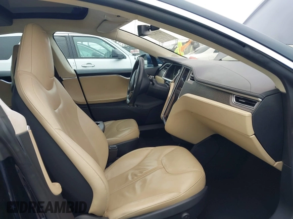 2014 Tesla Model S 60 with VIN 5YJSA1H10EFP30234, listed as a IAAI auction lot 42182249 with 186,654 mi miles and . Bid and sale history available at DreamBid. Image 5.