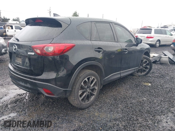 2016 Mazda CX-5 Grand Touring z VIN JM3KE4DY5G0742686, wystawiony jako IAAI lot #41598719 z przebiegiem 117 643 mil mil oraz . Historia ofert i sprzedaży dostępna na DreamBid. Obrazek 4.