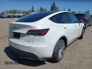 2022 Tesla Model Y Long Range z VIN 7SAYGDEE7NF418223, wystawiony jako IAAI lot #42046651 z przebiegiem 18 724 mil mil oraz . Historia ofert i sprzedaży dostępna na DreamBid. Obrazek 4.
