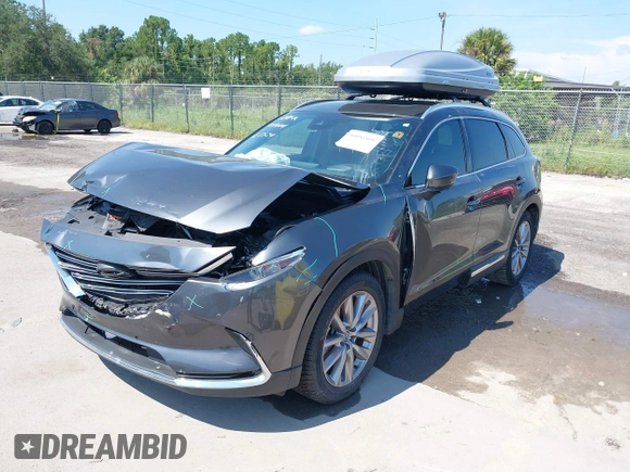2022 Mazda CX-9 Grand Touring with VIN JM3TCBDY4N0618680, listed as a IAAI auction lot 40086806 with 34,142 mi miles and . Bid and sale history available at DreamBid. Image 17.