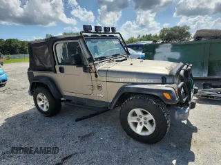 2003 Jeep Wrangler Rubicon with VIN 1J4FA69S13P310131, listed as a Copart auction lot 59139025 with 260,349 mi miles and Salvage title. Bid and sale history available at DreamBid. Image 4.