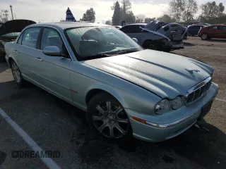 2005 Jaguar XJ with VIN SAJWA79C15SG47018, listed as a Copart auction lot 43087185 with 31,725 mi miles and Salvage Title. Bid and sale history available at carsss.com. Image 4.