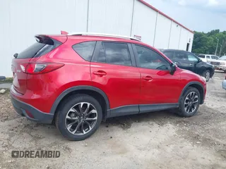 2016 Mazda CX-5 Grand Touring z VIN JM3KE2DY6G0693678, wystawiony jako IAAI lot #42443247 z przebiegiem 127 620 mil mil oraz . Historia ofert i sprzedaży dostępna na DreamBid. Obrazek 6.