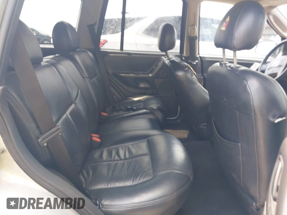 2004 Jeep Grand Cherokee Laredo with VIN 1J4GX48N04C435603, listed as a IAAI auction lot 42274197 with 256,163 mi miles and . Bid and sale history available at DreamBid. Image 8.