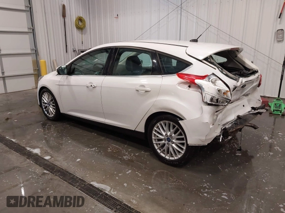 2014 Ford Focus Titanium with VIN 1FADP3N27EL110287, listed as a IAAI auction lot 42210697 with 107,741 mi miles and . Bid and sale history available at DreamBid. Image 3.