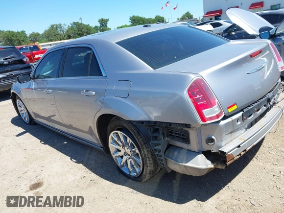 2014 Chrysler 300 with VIN 2C3CCAAG8EH264595, listed as a IAAI auction lot 42076996 with 101,659 mi miles and . Bid and sale history available at DreamBid. Image 3.